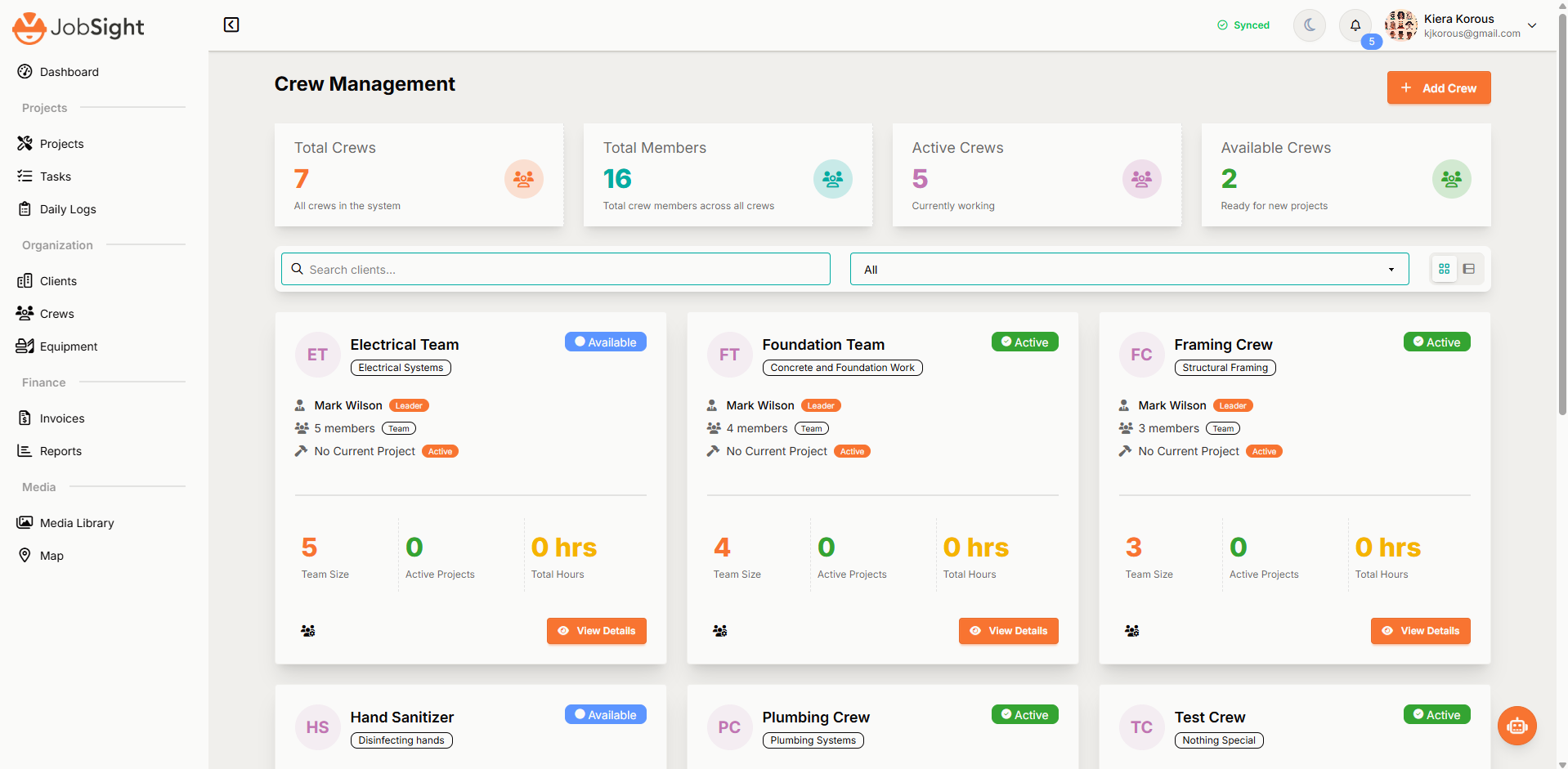JobSight Crew Management Dashboard showing crew cards with team details, member counts, active projects, and comprehensive status indicators